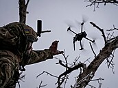 Ukrainian serviceman launches a kamikaze FPV drone at a front line, amid...