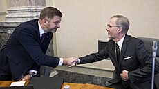 Premiér Petr Fiala a ministr vnitra Vít Rakušan před jednáním vlády 20....