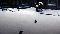 Boty Guniness zanechávají ve sn�hu stopy klasické pinty. Na �erném podkladu je...