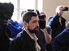 Obalovaný Ukrajinec Roman Rohozin pichází do soudní sín. (22. bezna 2024)