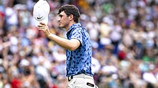 Americký golfista Davis Thompson po triumfu na turnaji John Deere Classic v...