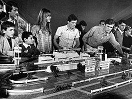Actors Francoise Hardy and Alain Gerard in a toy car pavilion in a scene from...