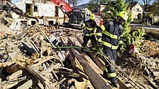 Demolice domu zasaeného povodnmi v umperské ulici v Jeseníku. (19. íjna...