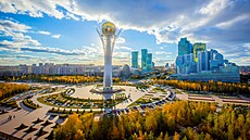 Golden autumn in the capital of Kazakhstan. Modern buildings and blue sky.