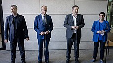 Vdce CSU Markus Söder, budoucí kanclé Friedrich Merz a lídi SPD Lars...