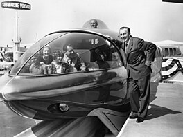 Richard Nixon and his family prepare to ride the Monorail at Disneyland in...