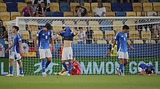 Italtí hrái smutní po inkasování branky v prodlouení tvrtfinálového zápasu...