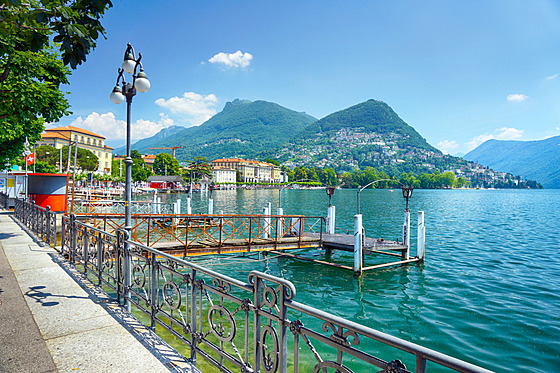 Lake Lugano promenade with panoramic views of the city and the Alps, Lugano,...