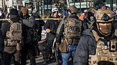 Federální imigra�ní agenti v Minneapolisu hlídají oblast, kde se podle...