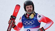 Zlatý medailista Loic Meillard ze �výcarska slaví vít�zství ve slalomu mu��....