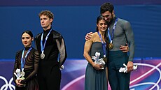 Vpravo nad�ení olympij�tí �ampioni Laurence Fournierová Beaudryová a Guillaume...