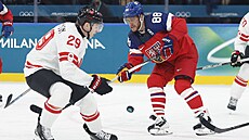 David Pastr�ák p�i souboji s Nathanem Mackinnonem v olympijském zápase mezi...