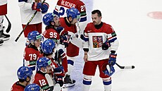 Zklamaní �e�tí hokejisté po prohraném duel s Kanadou na záv�r skupinové fáze...