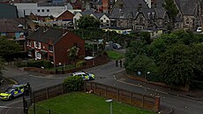 Policisté na severu Belfastu ohledávají místo trestného �inu. (9. �ervna 2026)