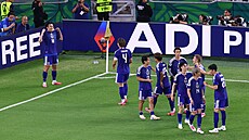 Japon�tí fotbalisté slaví gól do sít� Tuniska.