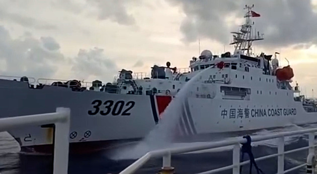 Philippines accuses China of water cannon use at disputed shoal; China warns against provocation