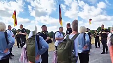 Policie vykázala mu�e s n�meckou vlajkou z prostor p�ed �í�ským sn�mem.