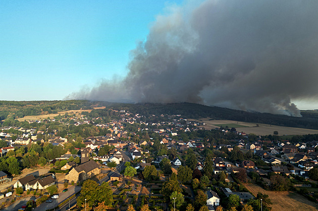 Germany evacuates village near Belgian border due to wildfire; Berlin building fire injures five