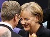 Angela Merkelová pijímá gratulace a kvtiny