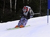 Bec na lyích Jií Magál v brance v obím slalomu. S nemizícím úsmvem.