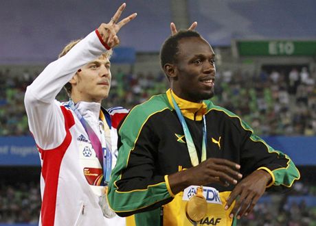 Usain Bolt se zlatou medail a Lemaitre.