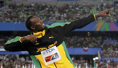 Usain Bolt se zlatou medailí.