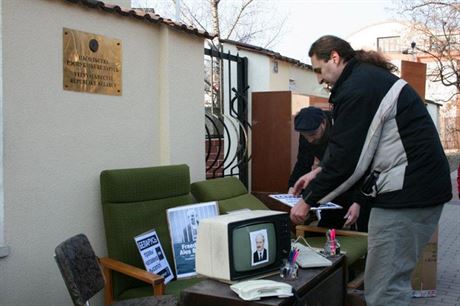 Activists placed office furniture in front of the Belarus embassy in Prague to symbolize the eviction of rights organizations from Belarus
