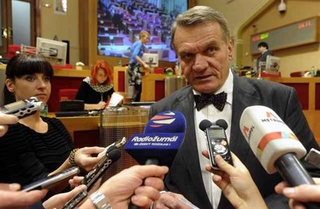 Prague Mayor Bohuslav Svoboda talks with reporters during a meeting of the Prague City Council; according to a study by the civic group Nai politici, in the overwhelming majority of tenders Prague politicians had at least indirect links with the winning
