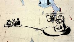 Stencil z pražské zdi, na němž si neznámý umělec tropí žerty z prezidenta Miloše Zemana, jenž za pomoci ochranky brázdil rybník v nafukovacím člunu. Na své tahouny křičí: „Na Bělehrad!“