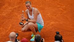 Petra Kvitova of the Czech Republic poses with her trophy after winning the...
