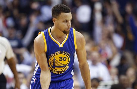 Golden State Warriors guard Stephen Curry reacts after a 3-point basket during...