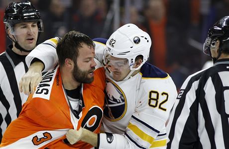 Philadelphia Flyers' Radko Gudas (3) and Buffalo Sabres' Marcus Foligno (82)...