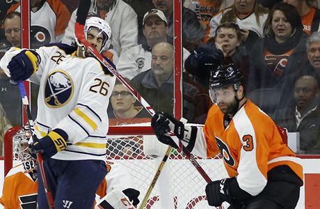 Buffalo Sabres' Matt Moulson (26) takes a stick to the head from Philadelphia...