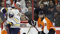 Buffalo Sabres' Matt Moulson (26) takes a stick to the head from Philadelphia...