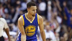 Golden State Warriors guard Stephen Curry reacts after a 3-point basket during...
