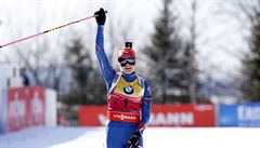 Gabriela Soukalova of the Czech Republic crosses the finish line to win the...
