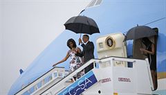 Barack Obama spolu s první dámou USA Michelle Obamovou po píletu na Kubu