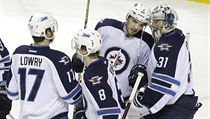 Winnipeg Jets goalie Ondrej Pavelec (31), from the Czech Republic, celebrates...