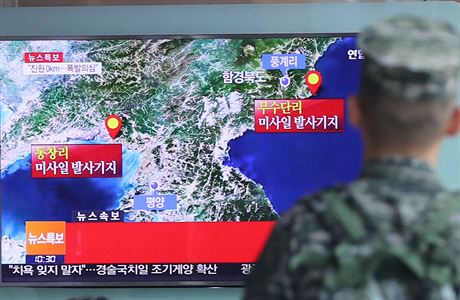 A South Korean soldier watches a TV broadcasting a news report on Seismic...