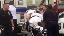 Policemen place in an ambulance a man they identified as Ahmad Khan Rahami in...
