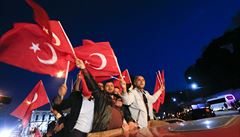 Supporters of Turkish President Tayyip Erdogan wave national flags in Istanbul,