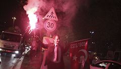 A supporter of Turkish President Tayyip Erdogan celebrates on a street in...