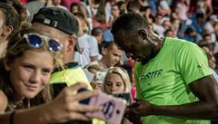 Usain Bolt se v cíli stovky na Zlaté trete 2017, kterou vyhrál asem 10,06...