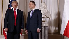U.S. President Donald Trump, left, is greeted by Polish President Andrzej Duda...