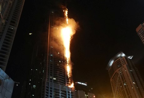 Flames shoot up the sides of the Torch tower residential building in the Marina...