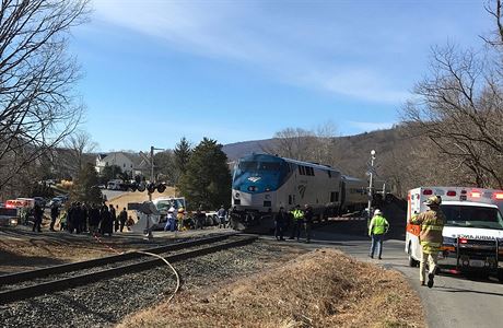 First responders work at the scene where train carrying Republican members of...