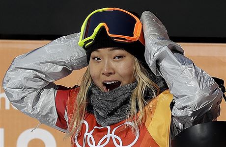 Chloe Kim, of the United States, reacts to her score during the women's...