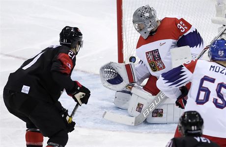 Mason Raymond (21), of Canada, shoots the puck past goalie Pavel Francouz (33),...