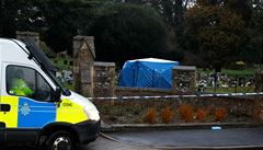 A tent used by police forensic investigators covers the grave of Alexander...