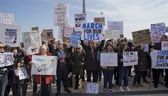 People hold banners during the 